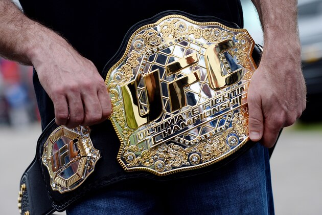 DAYTONA BEACH, FL - FEBRUARY 22:  NASCAR driver Kevin Harvick holds an UFC belt presented to him by Donald 'Cowboy' Cerrone (not pictured) at Daytona International Speedway on February 22, 2014 in Daytona Beach, Florida.  (Photo by Jared C. Tilton/Getty Images)