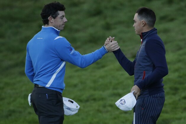 Europe’s Rory McIlroy, left, and Rickie Fowler, right, of the US shake hands at the end of their foursomes match on the first day of the Ryder Cup golf tournament at Gleneagles, Scotland, Friday, Sept. 26, 2014. (AP Photo/Matt Dunham) Europe’s Rory McIlroy, left, and Rickie Fowler, right, of the US shake hands at the end of their foursomes match on the first day of the Ryder Cup golf tournament at Gleneagles, Scotland, Friday, Sept. 26, 2014. (AP Photo/Matt Dunham)