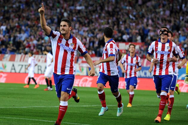MADRID, SPAIN - SEPTEMBER 27:  Koke of Club Atletico de Madrid celebrates after scoring his team's opening goal during the La Liga match between Club Atletico de Madrid and Sevilla FC at Vicente Calderon Stadium on September 27, 2014 in Madrid, Spain.  (Photo by Denis Doyle/Getty Images)
