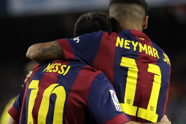 Barcelona's Lionel Messi, from Argentina, celebrates scoring the opening goal with Barcelona's Neymar, from Brazil, during the Joan Gamper trophy friendly match between Barcelona and Leon at the Camp Nou stadium in Barcelona, Spain, Monday, Aug. 18, 2014. (AP Photo/Emilio Morenatti)