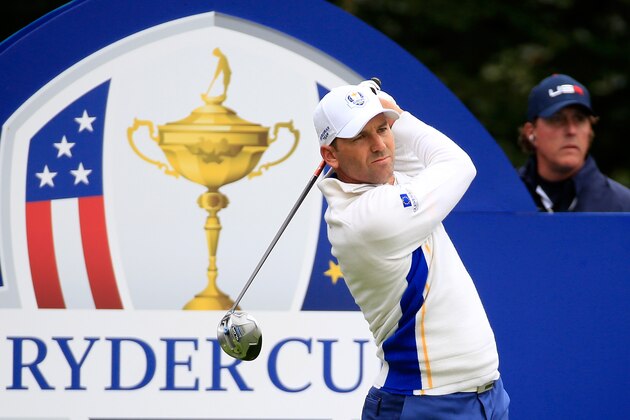 AUCHTERARDER, SCOTLAND - SEPTEMBER 27: Sergio Garcia of Europe tees off on the 5th hole watched by Phil Mickelson of the United States during the Afternoon Foursomes of the 2014 Ryder Cup on the PGA Centenary course at the Gleneagles Hotel on September 27, 2014 in Auchterarder, Scotland.  (Photo by Jamie Squire/Getty Images)