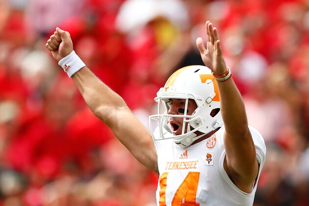 ATHENS, GA - SEPTEMBER 27:  Justin Worley #14 of the Tennessee Volunteers celebrates a touchdown by Jalen Hurd #1 of the Tennessee Volunteers against the Georgia Bulldogs at Sanford Stadium on September 27, 2014 in Athens, Georgia.  (Photo by Kevin C. Cox/Getty Images)
