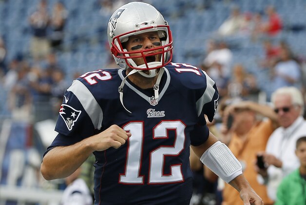 New England Patriots quarterback Tom Brady gets pumped up as he runs onto the field before an NFL football game against the Oakland Raiders Sunday, Sept. 21, 2014, in Foxborough, Mass. (AP Photo/Elise Amendola)