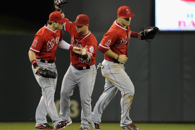 MINNEAPOLIS, MN - SEPTEMBER 4: (L-R) Collin Cowgill #7, Kole Calhoun #56 and Mike Trout #27 of the Los Angeles Angels of Anaheim celebrate a win against the Minnesota Twins on September 4, 2014 at Target Field in Minneapolis, Minnesota. The Angels defeated the Twins 5-4. (Photo by Hannah Foslien/Getty Images)
