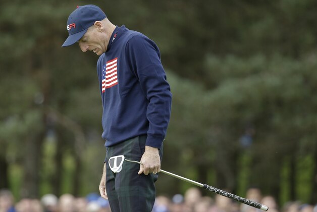 Jim Furyk of the US misses his putt on the 13th green  during the foursomes match on the second day of the Ryder Cup golf tournament at Gleneagles, Scotland, Saturday, Sept. 27, 2014. (AP Photo/Matt Dunham)