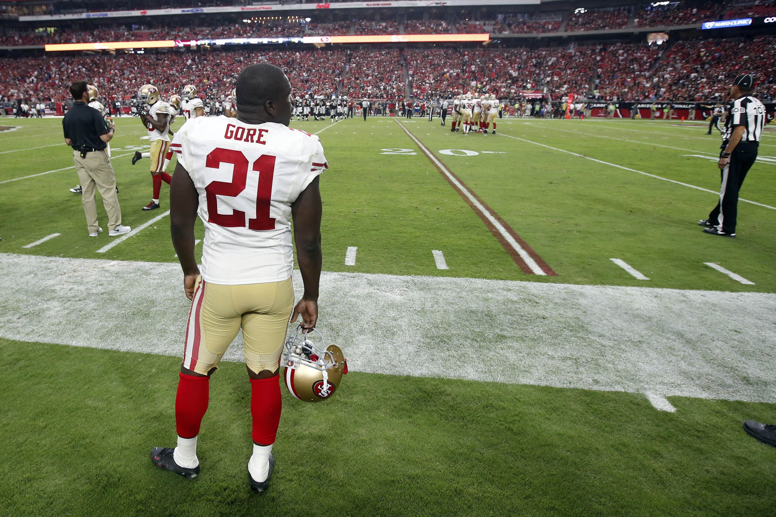San Francisco 49ers running back Frank Gore watches from the sidelines during the second half of the 49ers' NFL football game against the Arizona Cardinals, Sunday, Sept. 21, 2014, in Glendale, Ariz. The Cardinals won 23-14. (AP Photo/Ross D. Franklin) San Francisco 49ers running back Frank Gore watches from the sidelines during the second half of the 49ers' NFL football game against the Arizona Cardinals, Sunday, Sept. 21, 2014, in Glendale, Ariz. The Cardinals won 23-14. (AP Photo/Ross D. Franklin)