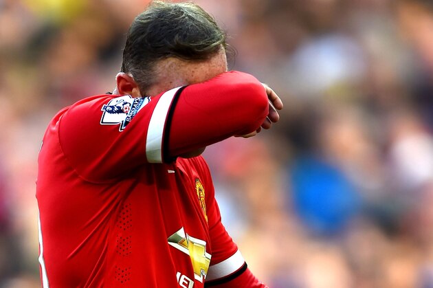 MANCHESTER, ENGLAND - SEPTEMBER 27:  Wayne Rooney of Manchester United walks off the pitch after receiving a straight red card following a foul on Stewart Downing of West Ham during the Barclays Premier League match between Manchester United and West Ham United at Old Trafford on September 27, 2014 in Manchester, England.  (Photo by Laurence Griffiths/Getty Images)
