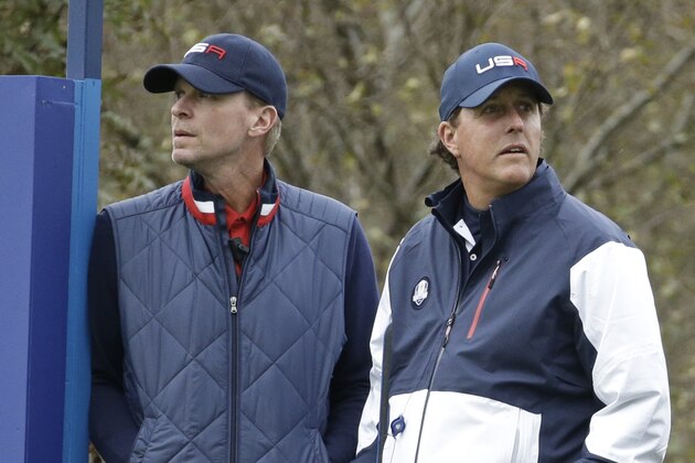 US vice captain Steve Stricker, left, and Phil Mickelson watch from the 6th tee box during the foursomes match on the second day of the Ryder Cup golf tournament, at Gleneagles, Scotland, Saturday, Sept. 27, 2014. (AP Photo/Matt Dunham)