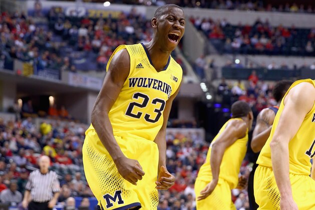 INDIANAPOLIS, IN - MARCH 14:  Caris LeVert #23 of the Michigan Wolverines celebrates in the game against the Illinois Fighting Illini during the Quarterfinals of the Big Ten Basketball Tournament at Bankers Life Fieldhouse on March 14, 2014 in Indianapolis, Indiana.  (Photo by Andy Lyons/Getty Images)