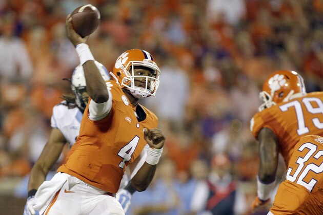 Clemson's Deshaun Watson (4) gets a pass off against North Carolina during the second half of an NCAA college football game in Clemson, S.C., Saturday Sept. 27, 2014. Clemson won 50-35. (AP Photo/Bob Leverone)