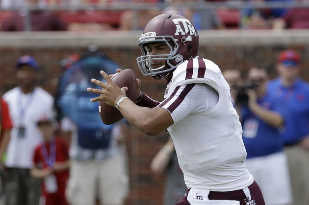 Texas A&M quarterback Kenny Hill prepares to pass during an NCAA college football game against SMU, Saturday, Sept. 20, 2014, in Dallas. (AP Photo/Tony Gutierrez)