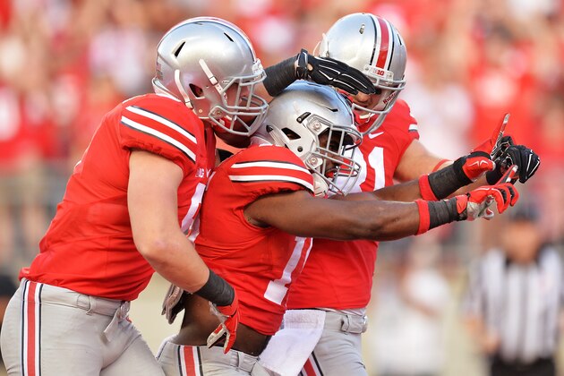 COLUMBUS, OH - SEPTEMBER 27:  Ezekiel Elliott #15 of the Ohio State Buckeyes celebrates his three-yard touchdown run in the first quarter against the Cincinnati Bearcats with Jeff Heuerman #5 and Nick Vannett #81 at Ohio Stadium on September 27, 2014 in Columbus, Ohio.  (Photo by Jamie Sabau/Getty Images)