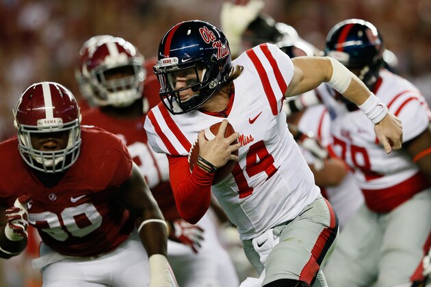 TUSCALOOSA, AL - SEPTEMBER 28:  Bo Wallace #14 of the Mississippi Rebels rushes against the Mississippi Rebels at Bryant-Denny Stadium on September 28, 2013 in Tuscaloosa, Alabama.  (Photo by Kevin C. Cox/Getty Images)