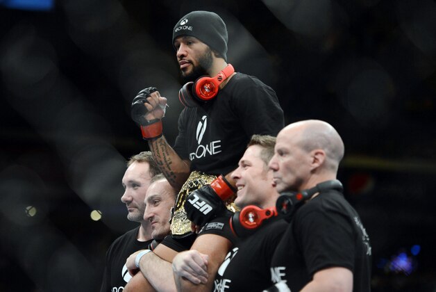 December 14, 2013; Sacramento, CA, USA; Demetrious Johnson celebrates after defeating Joseph Benavidez during the flyweight championship bout of the UFC on FOX 9 at Sleep Train Arena. Mandatory Credit: Kyle Terada-USA TODAY Sports