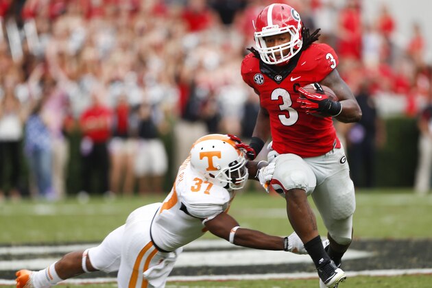 Georgia running back Todd Gurley (3) tries to break free from Tennessee defensive back Brian Randolph (37) during the second half of an NCAA college football game, Saturday, Sept. 27, 2014, in Athens, Ga. Georgia won 35-32. (AP Photo/John Bazemore)