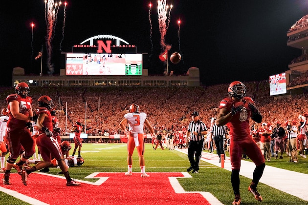 LINCOLN, NE - SEPTEMPER 27: Running back Ameer Abdullah #8 of the Nebraska Cornhuskers celebrates a touchdown during their game at against the Illinois Fighting Illini Memorial Stadium on September 27, 2014 in Lincoln, Nebraska.  (Photo by Eric Francis/Getty Images)