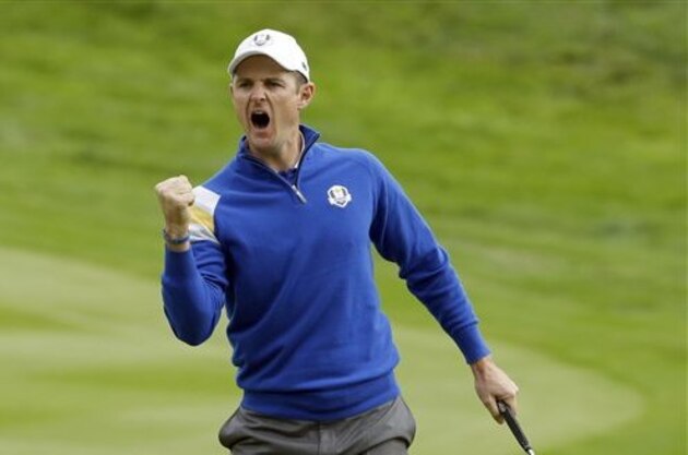 CORRECTS NAME OF GOLFER Europe’s Justin Rose celebrates on the 4th green to halve the hole during the singles match on the final day of Ryder Cup golf tournament at Gleneagles, Scotland, Sunday, Sept. 28, 2014. (AP Photo/Matt Dunham)