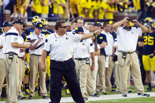 Michigan head coach Brady Hoke points from the field next to the sidelines in the fourth quarter of  an NCAA college football game against Minnesota in Ann Arbor, Mich., Saturday, Sept. 27, 2014. Minnesota won 30-14. (AP Photo/Tony Ding)