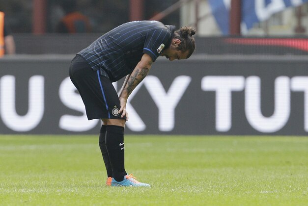 Inter Milan's Pablo Osvaldo stands after Cagliari's Albin Ekdal scored during the Serie A soccer match between Inter Milan and Cagliari at the San Siro stadium in Milan, Italy, Sunday, Sept. 28, 2014. (AP Photo/Antonio Calanni)