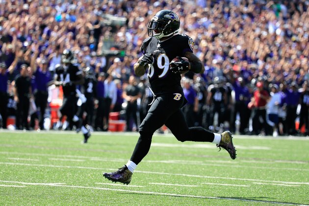 BALTIMORE, MD - SEPTEMBER 28:  Wide receiver Steve Smith #89 of the Baltimore Ravens scores a touchdown in the second quarter of a game against the Carolina Panthers at M&T Bank Stadium on September 28, 2014 in Baltimore, Maryland.  (Photo by Rob Carr/Getty Images)