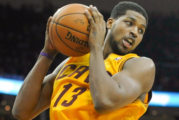 Mar 30, 2014; Cleveland, OH, USA; Cleveland Cavaliers forward Tristan Thompson (13) grabs a rebound in the fourth quarter against the Indiana Pacers at Quicken Loans Arena. Mandatory Credit: David Richard-USA TODAY Sports
