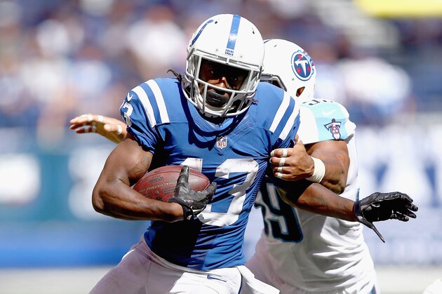INDIANAPOLIS, IN - SEPTEMBER 28:  T.Y. Hilton #13 of the Indianapolis Colts runs with the ball while defended by Wesley Woodyard #59 of the Tennessee Titans during the game at Lucas Oil Stadium on September 28, 2014 in Indianapolis, Indiana.  (Photo by Andy Lyons/Getty Images)