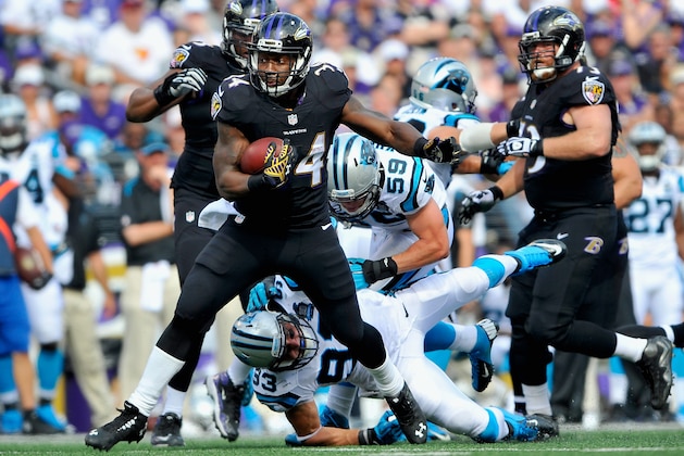 BALTIMORE, MD - SEPTEMBER 28:  Running back Lorenzo Taliaferro #34 of the Baltimore Ravens rushes during the second half of a game against the Carolina Panthers at M&T Bank Stadium on September 28, 2014 in Baltimore, Maryland.  (Photo by Larry French/Getty Images)