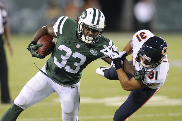New York Jets running back Chris Ivory (33) stiff arms Chicago Bears cornerback Isaiah Frey (31) in the second quarter of an NFL football game, Monday, Sept. 22, 2014, in East Rutherford, N.J. (AP Photo/Bill Kostroun)