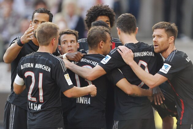 Munich players celebrate after scoring during the German first division Bundesliga soccer match between FC Cologne and Bayern Munich in Cologne, Germany, Saturday, Sept. 27, 2014. (AP Photo/Frank Augstein)