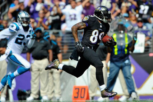 BALTIMORE, MD - SEPTEMBER 28:  Wide receiver Steve Smith #89 of the Baltimore Ravens scores a touchdown in the second quarter of a game against the Carolina Panthers at M&T Bank Stadium on September 28, 2014 in Baltimore, Maryland.  (Photo by Larry French/Getty Images)