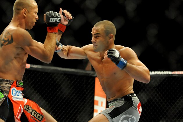 Sep 27, 2014; Las Vegas, NV, USA; Donald Cerrone (red gloves) fights Eddie Alvarez (blue gloves) during a lightweight fight at UFC 178 at MGM Grand Garden Arena. Mandatory Credit: Stephen R. Sylvanie-USA TODAY Sports