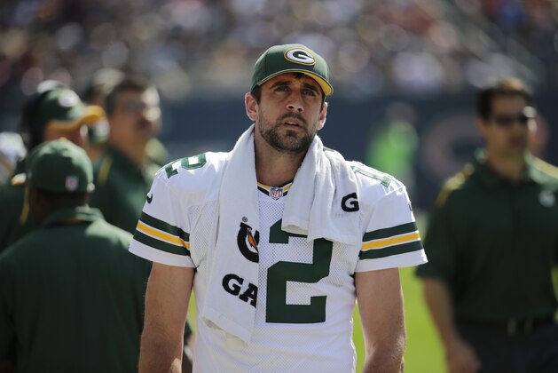 Green Bay Packers quarterback Aaron Rodgers (12) stands o the sidelines in the second half of an NFL football game against the Chicago Bears Sunday, Sept. 28, 2014, in Chicago. (AP Photo/Charles Rex Arbogast)
