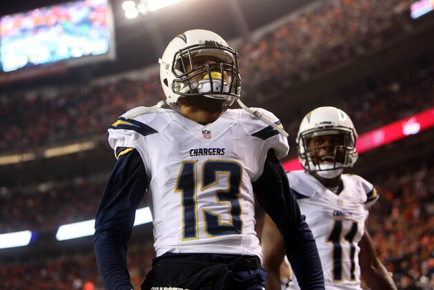 Dec 12, 2013; Denver, CO, USA; San Diego Chargers wide receiver Keenan Allen (13) celebrates with wide receiver Eddie Royal (11) after catching a touchdown pass during the first half at Mile High. The Chargers won 27-20.  Mandatory Credit: Chris Humphreys-USA TODAY Sports
