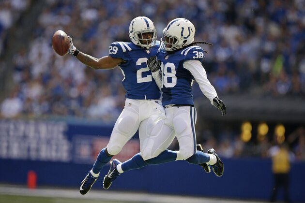 Indianapolis Colts strong safety Mike Adams, left, celebrate his interception with teammate Sergio Brown during the first half of an NFL football game against the Tennessee Titans in Indianapolis, Sunday, Sept. 28, 2014. (AP Photo/Darron Cummings)