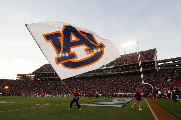 AUBURN, AL - NOVEMBER 30:  A member of Auburn Tigers cheer team waves a flag during their game against the Alabama Crimson Tide at Jordan-Hare Stadium on November 30, 2013 in Auburn, Alabama.  (Photo by Kevin C. Cox/Getty Images)