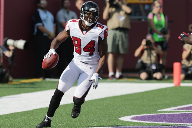 Atlanta Falcons wide receiver Roddy White (84) reacts after catching a 24-yard touchdown pass during the first half of an NFL football game against the Minnesota Vikings, Sunday, Sept. 28, 2014, in Minneapolis. (AP Photo/Jim Mone)