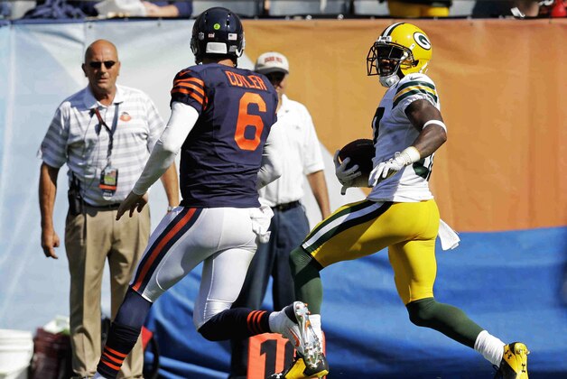 Chicago Bears quarterback Jay Cutler (6) chases Green Bay Packers cornerback Sam Shields (37) after Shields intercepted a pass in the second half of an NFL football game Sunday, Sept. 28, 2014, in Chicago. (AP Photo/Nam Y. Huh)