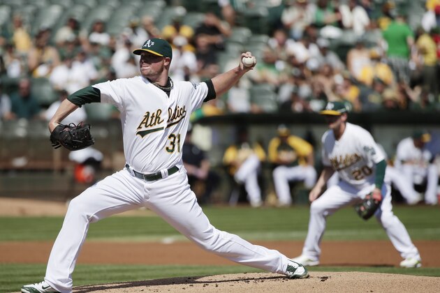 Oakland Athletics starting pitcher Jon Lester throws to the Los Angeles Angels during the first inning of a baseball game on Wednesday, Sept. 24, 2014, in Oakland, Calif. (AP Photo/Marcio Jose Sanchez)