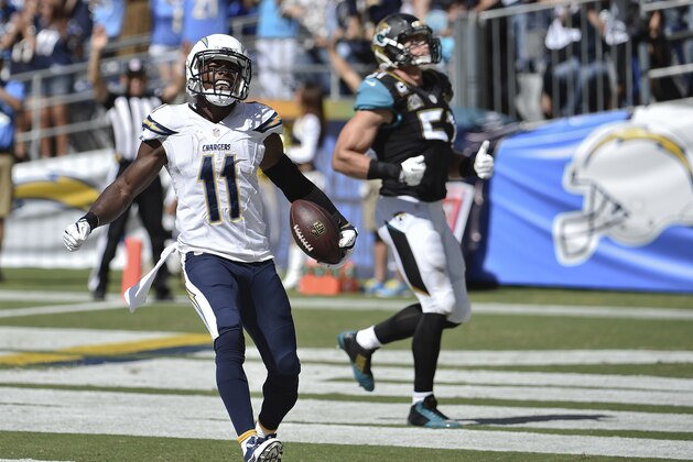 San Diego Chargers wide receiver Eddie Royal celebrates his 43-yard touchdown reception against the Jacksonville Jaguars during the first half of an NFL football game Sunday, Sept. 28, 2014, in San Diego.  (AP Photo/Denis Poroy)