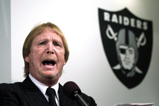 Oakland Raiders owner Mark Davis introduces new Raiders head football coach Dennis Allen during an NFL football news conference in Alameda, Calif., Monday, Jan. 30, 2012. (AP Photo/Paul Sakuma)