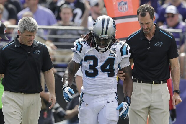 Carolina Panthers running back DeAngelo Williams (34) walks across the field after an injury during the first half of an NFL football game against the Baltimore Ravens in Baltimore, Sunday, Sept. 28, 2014. (AP Photo/Patrick Semansky)
