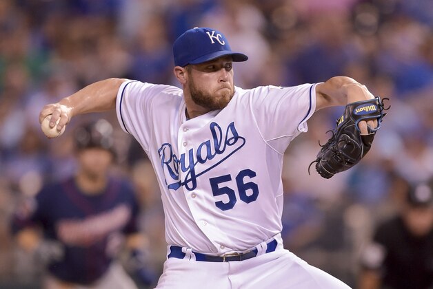 Kansas City Royals relief pitcher Greg Holland (56) throws in a baseball game between the Kansas City Royals and the Minnesota Twins on Wednesday, Sept. 27, 2014, in Kansas City, Mo. (AP Photo/Reed Hoffmann)