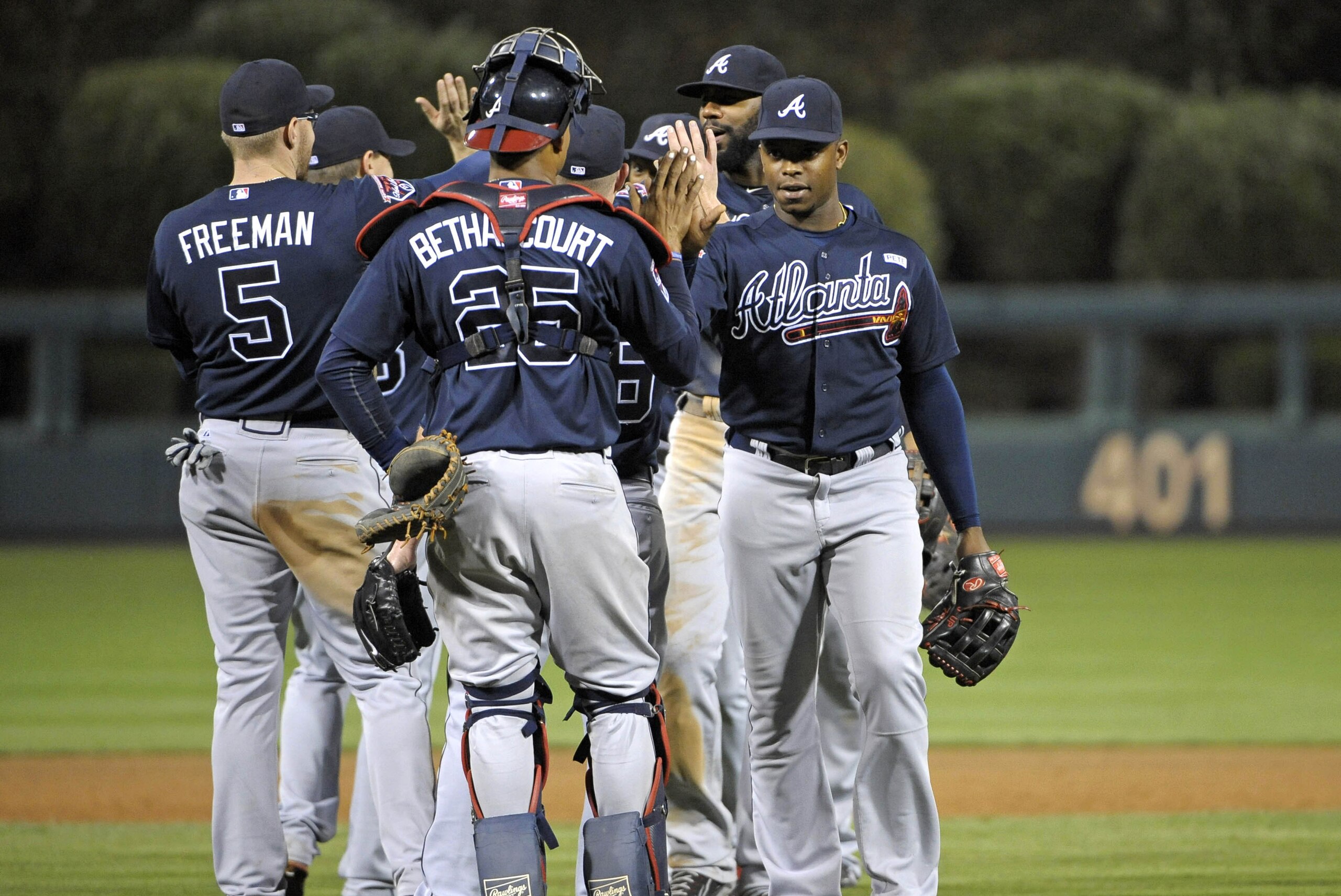 Sep 27, 2014; Philadelphia, PA, USA; Atlanta Braves left fielder Justin Upton (right) celebrates win against the Philadelphia Phillies with teammates at Citizens Bank Park. The Braves defeated the Phillies, 4-2. Mandatory Credit: Eric Hartline-USA TODAY Sports
