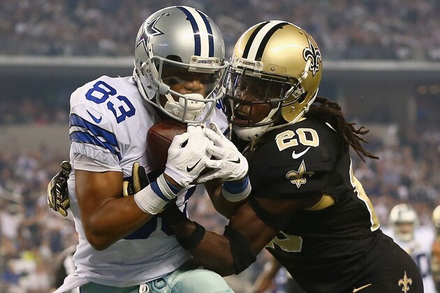 ARLINGTON, TX - SEPTEMBER 28:  Terrance Williams #83 of the Dallas Cowboys makes a touchdown pass reception against  A.J. Davis #20 of the New Orleans Saints in the second quarter at AT&T Stadium on September 28, 2014 in Arlington, Texas.  (Photo by Ronald Martinez/Getty Images)