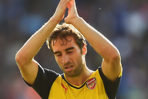 LEICESTER, ENGLAND - AUGUST 31: Mathieu Flamini of Arsenal applauds the fans after the Barclays Premier League match between Leicester City and Arsenal at The King Power Stadium on August 31, 2014 in Leicester, England.  (Photo by Laurence Griffiths/Getty Images)
