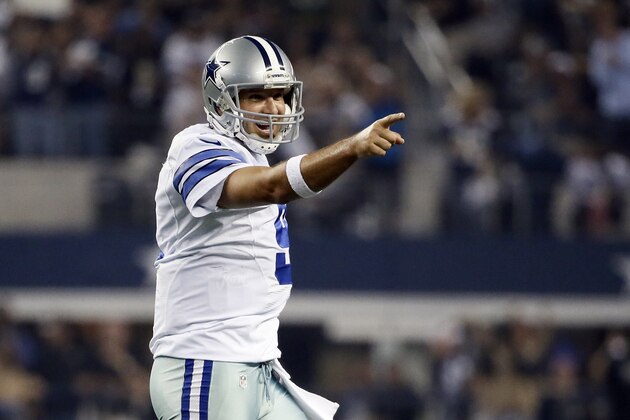 Dallas Cowboys' Tony Romo points to the sideline after a score against the New Orleans Saints during the second half of an NFL football game, Sunday, Sept. 28, 2014, in Arlington, Texas. (AP Photo/Brandon Wade)