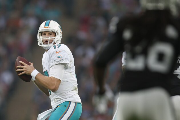 Miami Dolphins' Ryan Tannehill looks to pass during the first half of an NFL football game against the Oakland Raiders, Sunday, Sept. 28, 2014, at Wembley Stadium in London. (AP Photo/Lefteris Pitarakis)