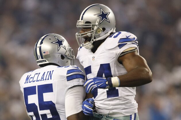 Sep 28, 2014; Arlington, TX, USA; Dallas Cowboys outside linebacker Bruce Carter (54) and Dallas Cowboys middle linebacker Rolando McClain (55) celebrate an interception in the second quarter against the New Orleans Saints at AT&T Stadium. Mandatory Credit: Tim Heitman-USA TODAY Sports