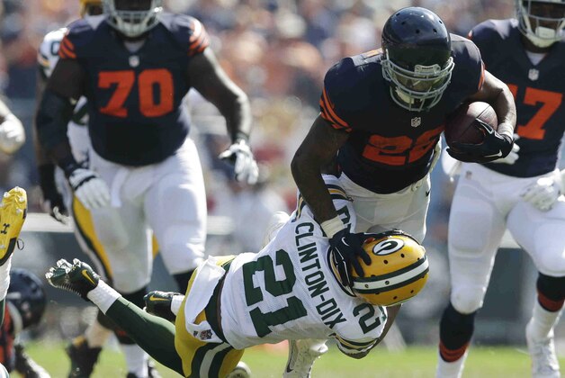 Green Bay Packers safety Ha Ha Clinton-Dix (21) tackles Chicago Bears running back Matt Forte (22) in the first half of an NFL football game Sunday, Sept. 28, 2014, in Chicago. (AP Photo/Nam Y. Huh)