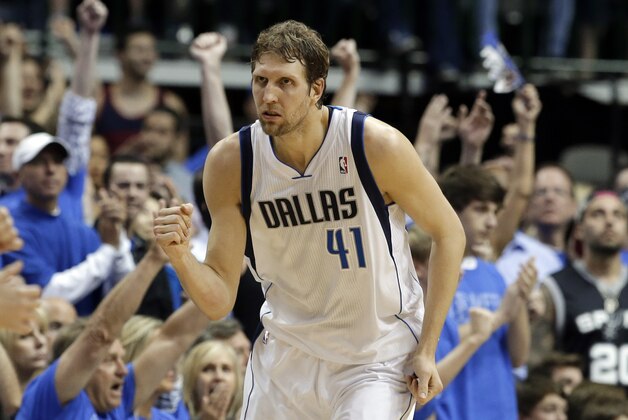 Dallas Mavericks' Dirk Nowitzki (41) of Germany celebrates sinking a three-point basket against the San Antonio Spurs in the second half of Game 4 of an NBA basketball first-round playoff series, Monday, April 28, 2014, in Dallas. The Spurs won 93-89. (AP Photo/Tony Gutierrez)